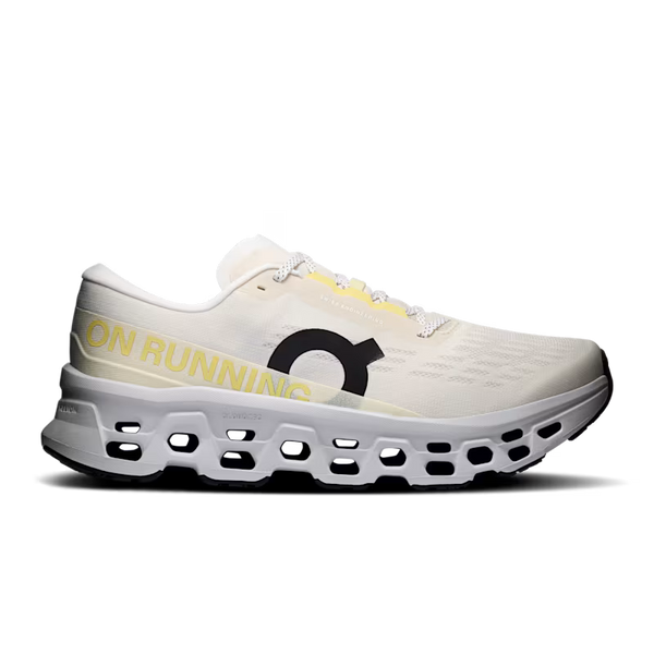 White running shoe with yellow accents on a white background