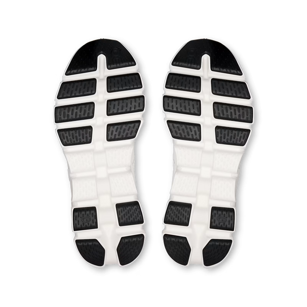 A pair of athletic shoe soles shown from above, featuring a white midsole with black textured outsole sections.