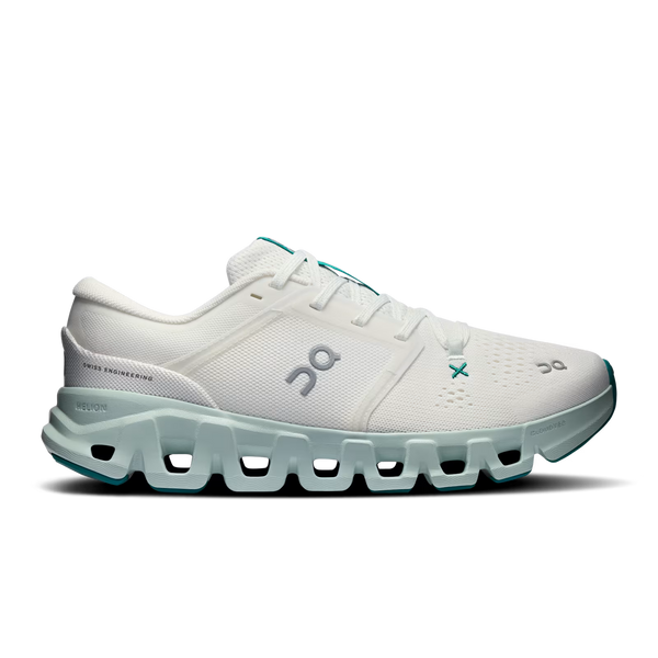 A white On Cloudrunning shoe with mint green accents and a chunky, sculpted sole, shown from a three-quarters angle on a white background.