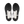 Top-down view of a pair of athletic shoe soles, showing a black textured outsole with white heel inserts on a plain white background.