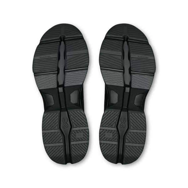 A pair of black athletic shoe soles shown from a top-down view on a plain white background.