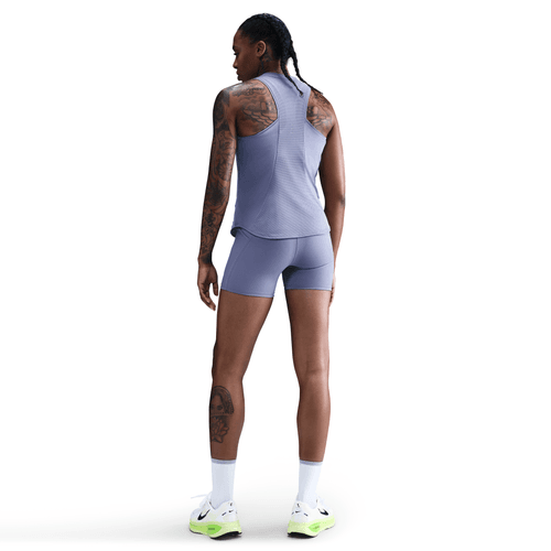 Person wearing a light blue athletic outfit on a white background