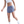 Person wearing blue athletic shorts with a Nike logo on a white background
