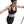 Woman wearing a black sports bra and leggings on a white background