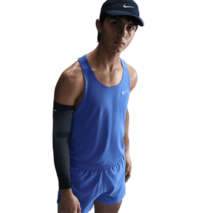 Person wearing a blue tank with Nike branding on a white background