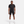 Man wearing a black Nike athletic outfit on a white background