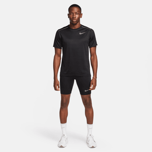 Man wearing a black Nike athletic outfit on a white background