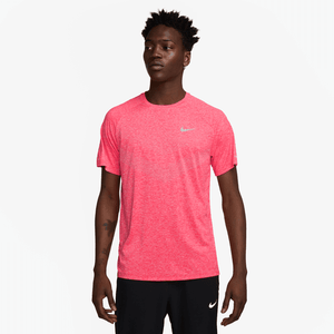 Person wearing a bright red Nike t-shirt on a white background