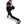 Person in black athletic wear performing a leg exercise with a medicine ball on a white background