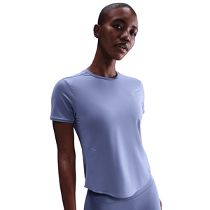 Woman wearing a light blue athletic outfit on a white background