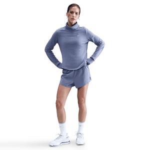 Person wearing a blue athletic outfit on a white background