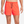 Orange athletic shorts with a Nike logo on a white background