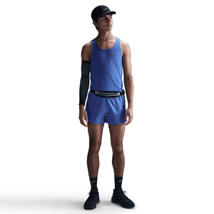 Person wearing a blue athletic outfit with a white background