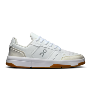 White sneaker with brown sole on a white background