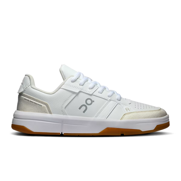 White sneaker with brown sole on a white background
