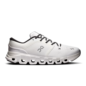 White athletic shoe with black laces on a white background