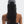 Person wearing a gray cap with a long braided ponytail on a white background