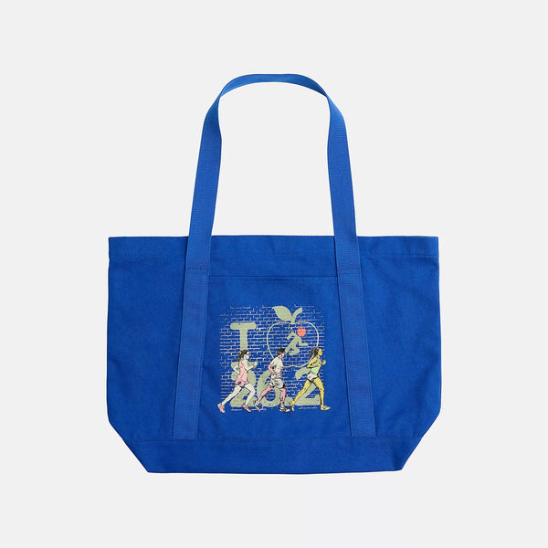 Blue tote bag with a graphic design on a light gray background