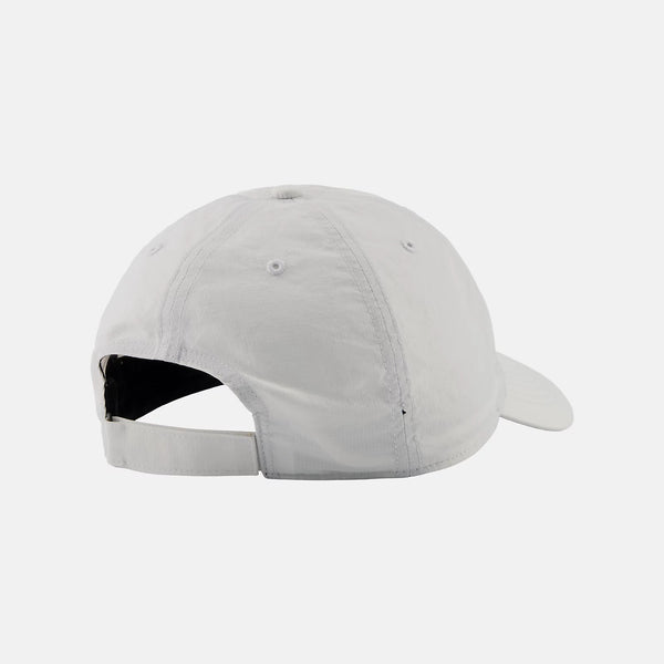 White baseball cap on a light gray background