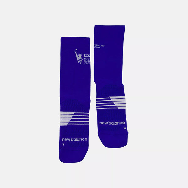 Two blue socks with white branding on a light gray background