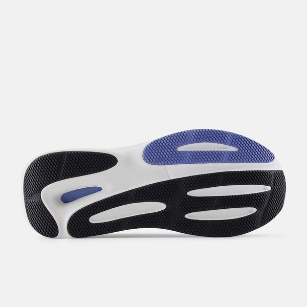 Close-up of a shoe sole with black, white, and blue design on a light gray background