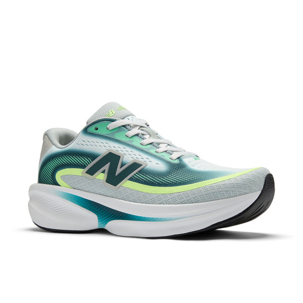 White New Balance running shoe with green and blue accents on a white background.