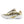 A New Balance running shoe in off-white, gold, and black, shown from a side profile view against a plain white background.