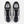 A New Balance running shoe in white, black, and gray, shown against a plain white background.