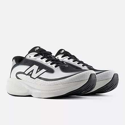 A New Balance running shoe in white, black, and gray, shown against a plain white background.