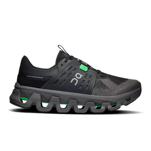 A black On Lifestyle and fashion shoe with a chunky, wavy gray sole and bright green accents on the laces and midsole, shown from a side profile on a white background.