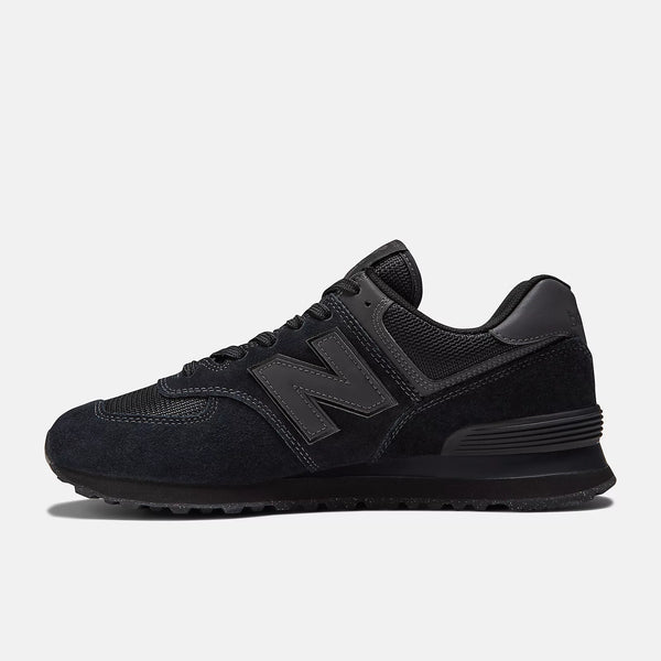 Medial side of a NB fashion shoe with a black upper and black midsole.