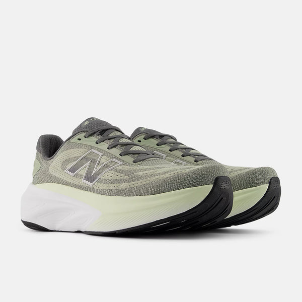Gray running shoes with black and white sole on a light gray background