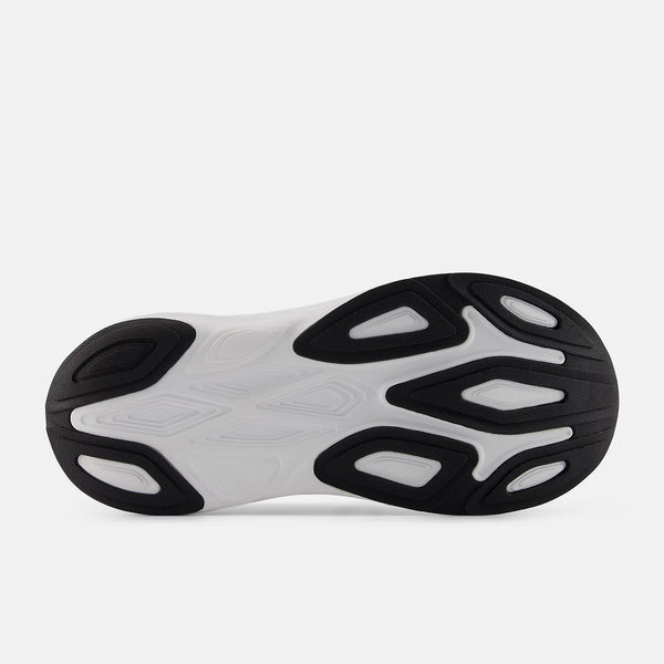 Close-up of a shoe sole with black and white design on a light gray background