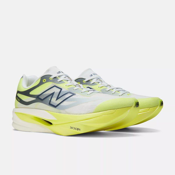 A pair of New Balance running shoes in a white, gray, and neon yellow colorway, shown from a side profile view on a light gray background.