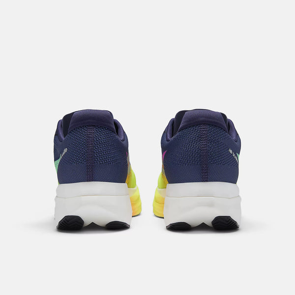 Pair of blue running shoes with white soles on a light gray background