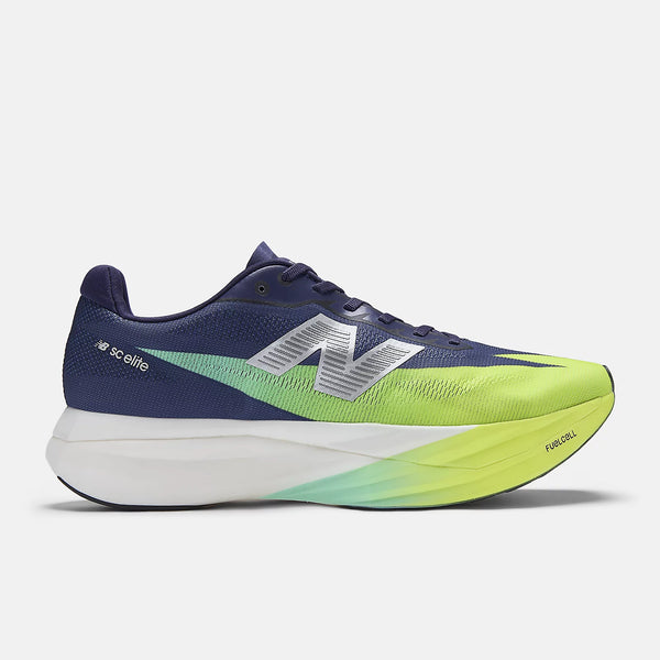 Navy and green running shoe with New Balance logo on a white background