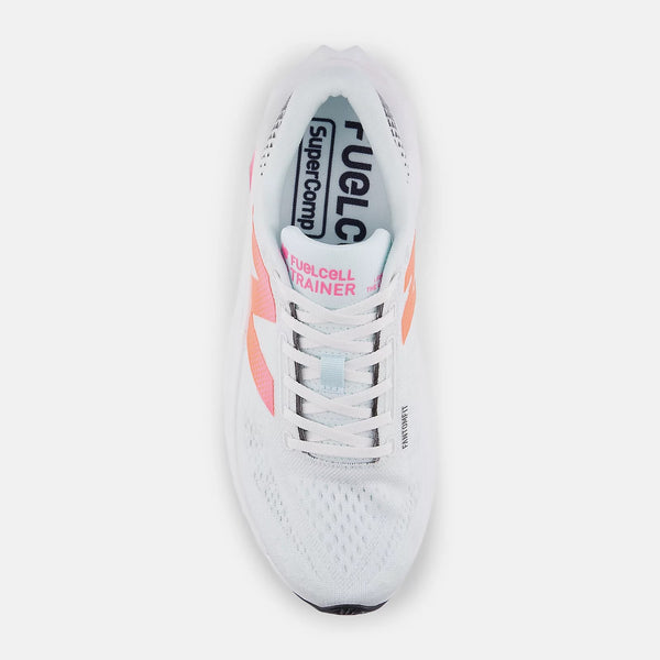White running shoe with pink accents on a white background