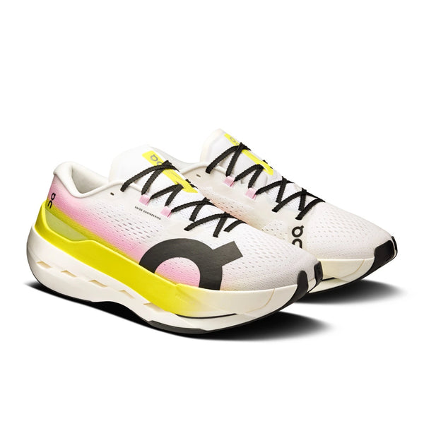 White running shoes with black and yellow accents on a white background