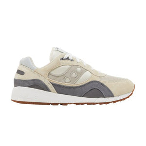 Beige and gray sneaker with white sole on a white background