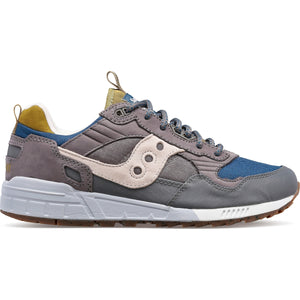 Gray and blue sneaker with a white sole on a white background