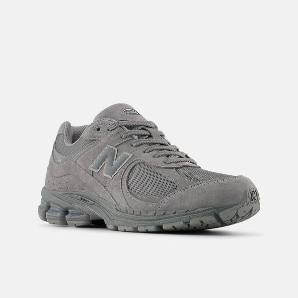 Gray sneaker with New Balance logo on a white background