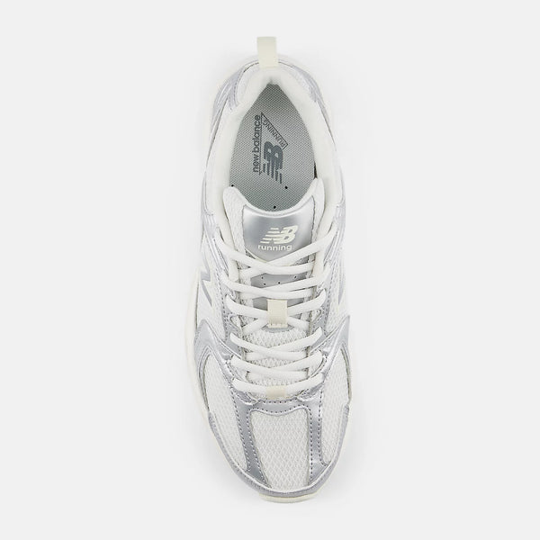 White sneaker with New Balance logo on a white background
