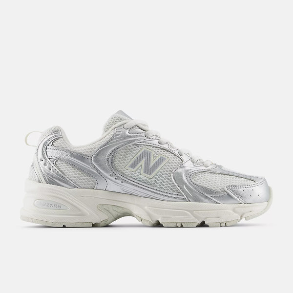 Silver New Balance sneaker on a white background