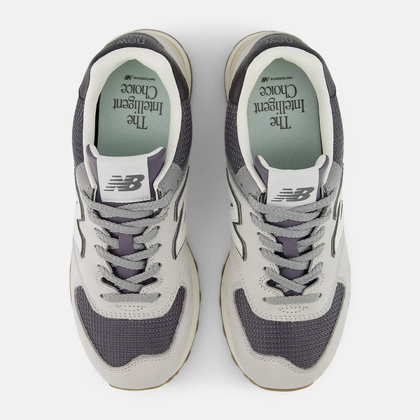 Pair of gray and white sneakers on a white background