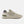 Beige NB lifestyle sneaker with New Balance logo on a white background and a green heel counter.