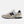 Beige and navy New Balance sneaker on a white background