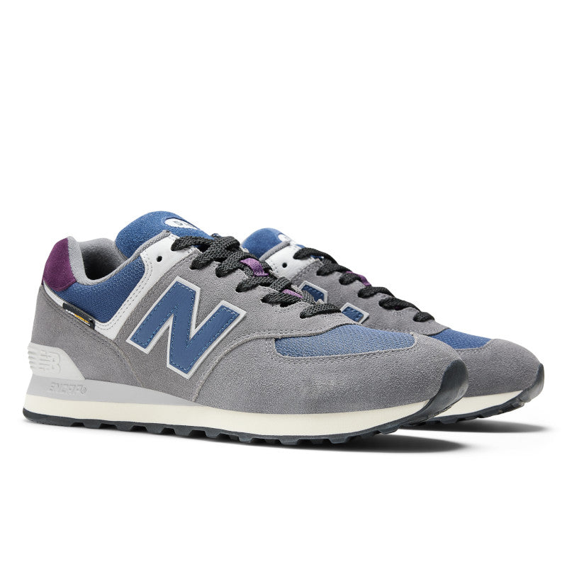 The NB 574 has a blue N logo on the medial side