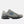A New Balance athletic shoe in gray and black with a blue 'N' logo on the side, shown against a light gray background.