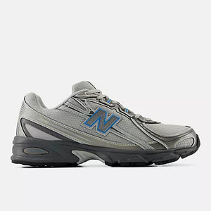 A New Balance athletic shoe in gray and black with a blue 'N' logo on the side, shown against a light gray background.