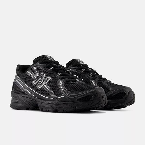 Black New Balance sneakers on a white background